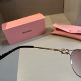 Sunglass miumiu