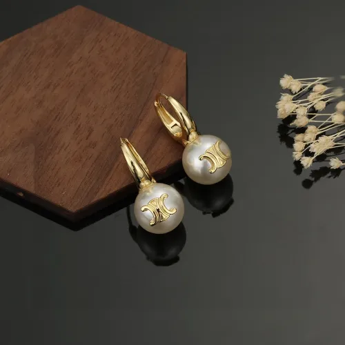 Celine's new pearl stud earrings.