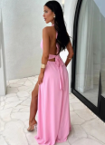 Solid-color maxi dress with a halter V-neck and side slit.