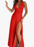 Solid-color maxi dress with a halter V-neck and side slit.