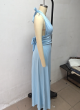 Solid-color maxi dress with a halter V-neck and side slit.