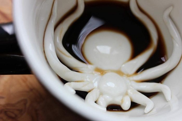 Scare the bugs out of someone with a mug that has a spider at the bottom