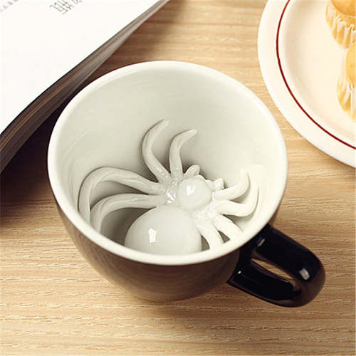 Scare the bugs out of someone with a mug that has a spider at the bottom