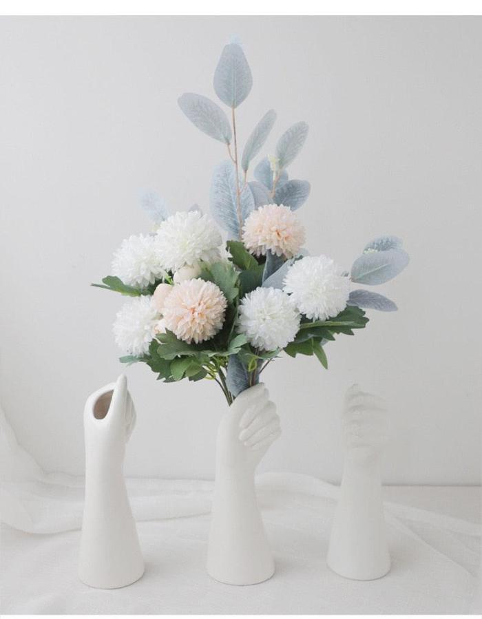 Hand Holding Flower Vase