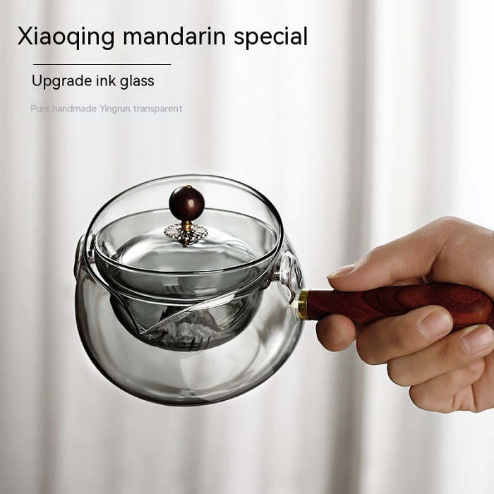 Rotary glass teapot with infuser.