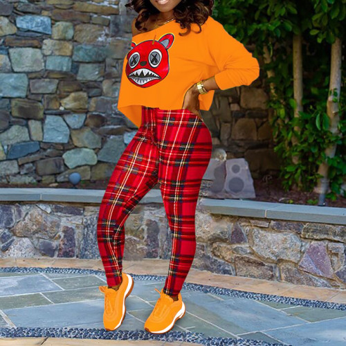 Plus Size Printed Orange Top with Plaid Tight Pants
