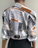 Nespaper Print White Knotted Long Sleeve Blouse