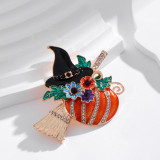 Halloween pumpkin witch with broom, dripping oil, rhinestone brooch