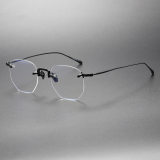 Olet Optical's LE0411 spectacles rimless, showcasing an ultra-light black titanium frame with a sophisticated rimless design and adjustable nose pads, combining style and comfort for a seamless visual experience.