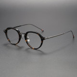 Olet Optical's LE0491 model showcases tortoiseshell glasses with a modern geometric frame and gunmetal titanium arms, featuring comfortable adjusted nose pads for a perfect fit and timeless style.
