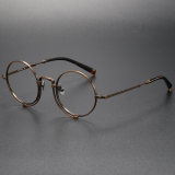Olet Optical's LE0023 bronze round frame prescription glasses exhibit an anti-allergic bronze finish, embossed letter detailing, and a unique double bridge design, complemented by tortoiseshell-colored temple tips for a lightweight, comfortable fit.