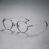 Olet Optical's LE0141 Round Eyeglass Frames in Silver with Blue highlights, featuring allergy-friendly IP plating and a weightless feel for maximum style and comfort.