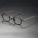 Olet Optical LE0278 rectangle glasses featuring black frames with gold arms, designed with a screwless construction and hypoallergenic IP plating.
