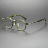 Olet Optical's LE0455 translucent green glasses, featuring round frames with pure titanium arms, combining style and comfort
