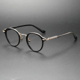 Olet Optical's LE0279 black round glasses featuring a sleek black acetate frame with luxurious gold titanium accents, designed for hypoallergenic comfort and timeless style.

