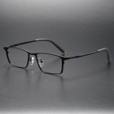 Olet Optical's LE0160 black rectangle glasses, featuring a pure titanium frame and legs with transparent gray temple tips for stylish durability.

