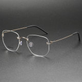 Olet Optical's LE0072 titanium rimless glasses in gold, featuring screwless, elastic titanium temples with stylish black temple tips for advanced comfort.

