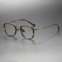 Round Tortoise Eyeglasses LE0414: Elegant TortoiseShell with Bronze Titanium Accents