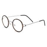 Olet Optical round tortoise shell glasses with lightweight titanium frame and adjustable nose pads, designed to reduce allergies and provide comfort.

