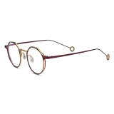 Olet Optical LE0778 Gold and Red Round Glasses with Titanium Frame and Unique Circular Cutout Temple Tips

