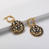 aretes para mujer con cara feliz negra 18K estilo bello