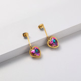 aretes dorado con dijes corazon