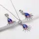 juego de collar y aretes plateada con piedra azul