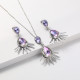 juego de collar y aretes plateada con piedra lila