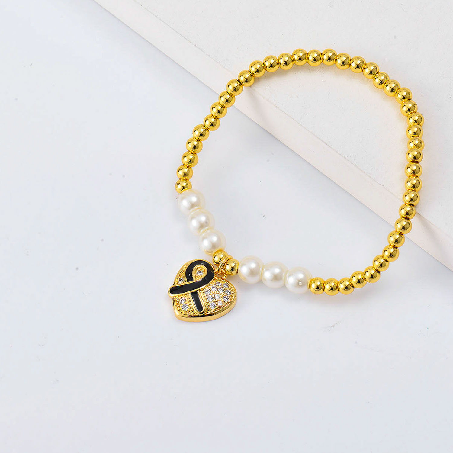 Pulseras de moda Oro Laminado con Dije de corazon cinta y perlas