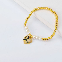 Pulseras de moda Oro Laminado con Dije de corazon cinta y perlas