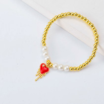 Pulseras bolitas Oro Laminado con mode corazon y perlas