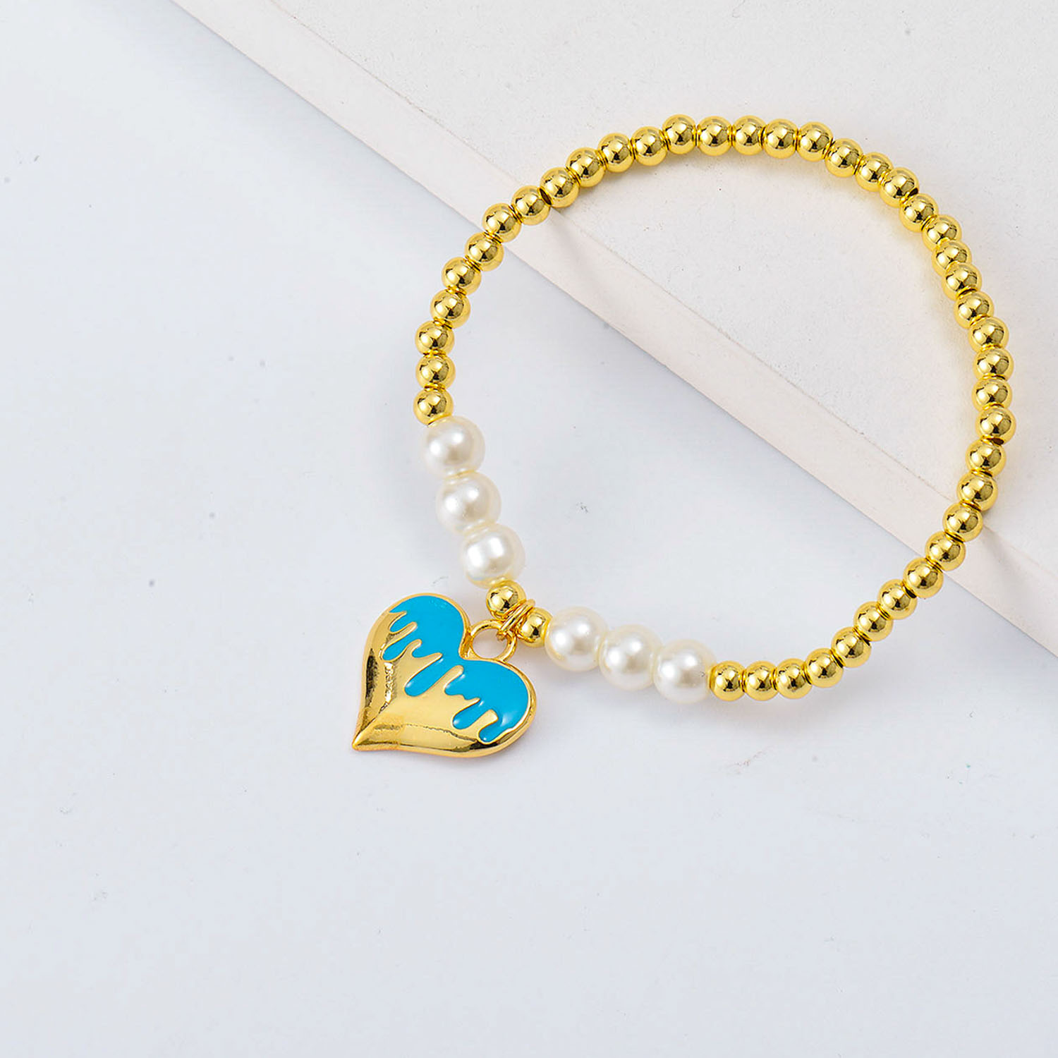 pulseras aesthetic Oro Laminado con Dije de corazon azul y perlas