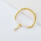pulseras aesthetic Oro Laminado con dije signo de moda y perlas