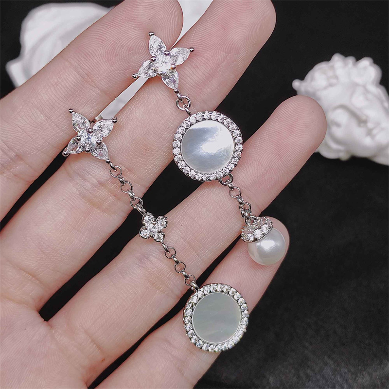 aretes de concha con diamante y perla para mujer