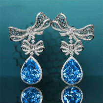 aretes de topacio azul y diamante para mujer