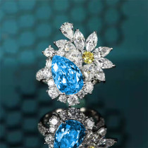 anillo de gota de topacio con flor de diamantes para mujer