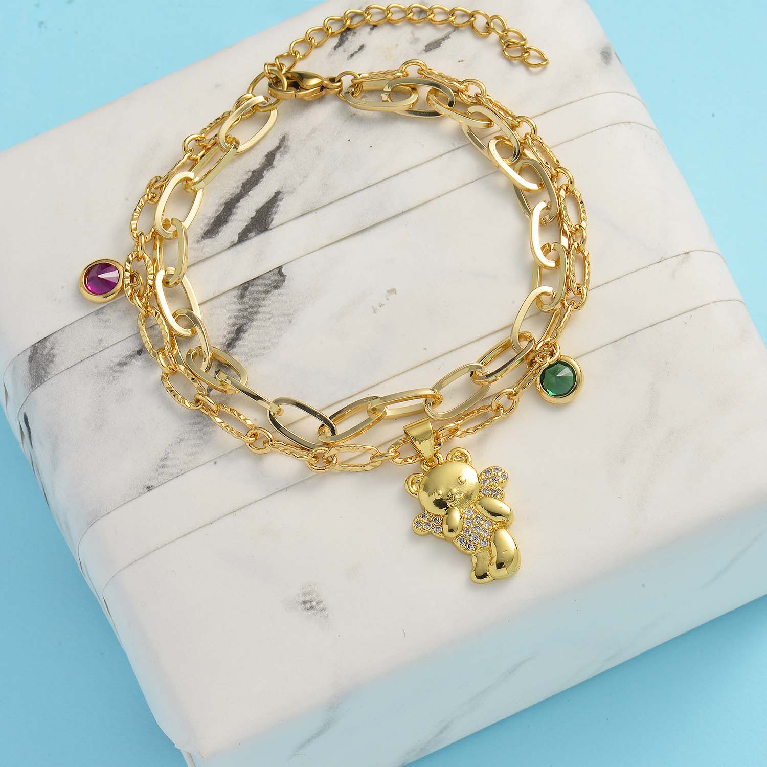 pulsera dorada para mujer en doble cadena con osito dorado