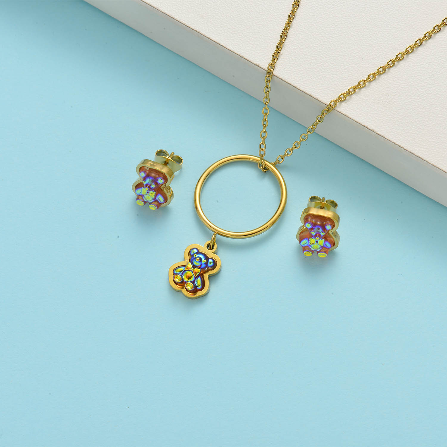 conjunto para playa con aro dije de osito color dorado 18k
