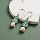 aretes en acero color plateado con perlas osito seleste