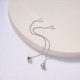 aretes de mujer acero con cadenita campana color plateado para mujer