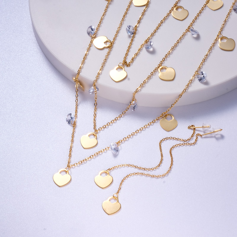 conjuntos diseno nuevo de acero con aretes de cadenita  piedras corazoncito dorado para mujer