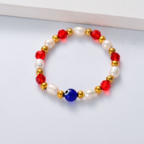 pulsera de perlas con bolitas de evil eyes azul y circon rojo para mujer por mayor
