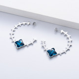 ARRACADA DE ACERO INOXIDABLE PLATEADO CON CIRCON AZUL POR MAYOR