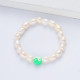 pulsera de perla natural estilo de playa con dije verde para mujer