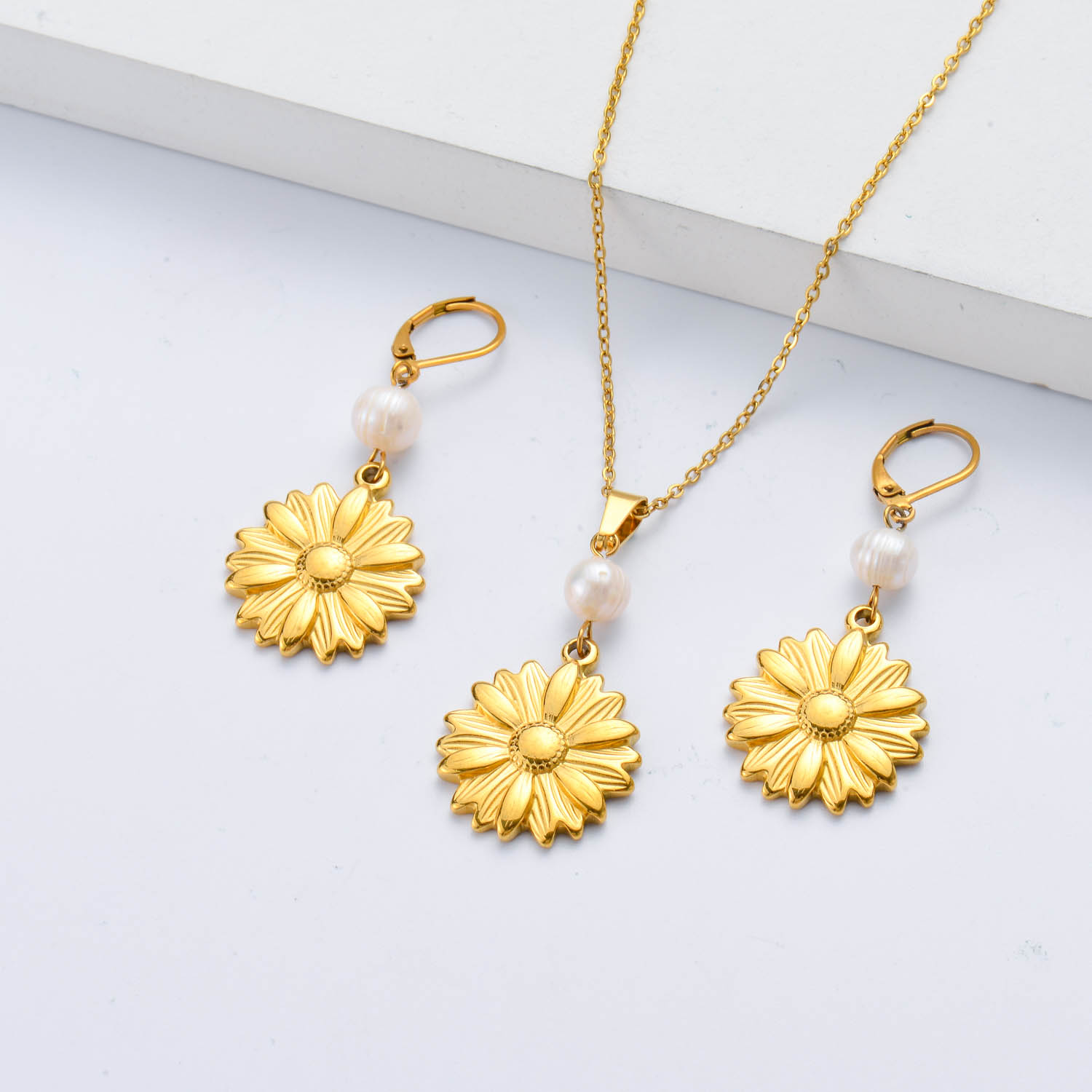 conjunto de acero con dije de girasol para mujer