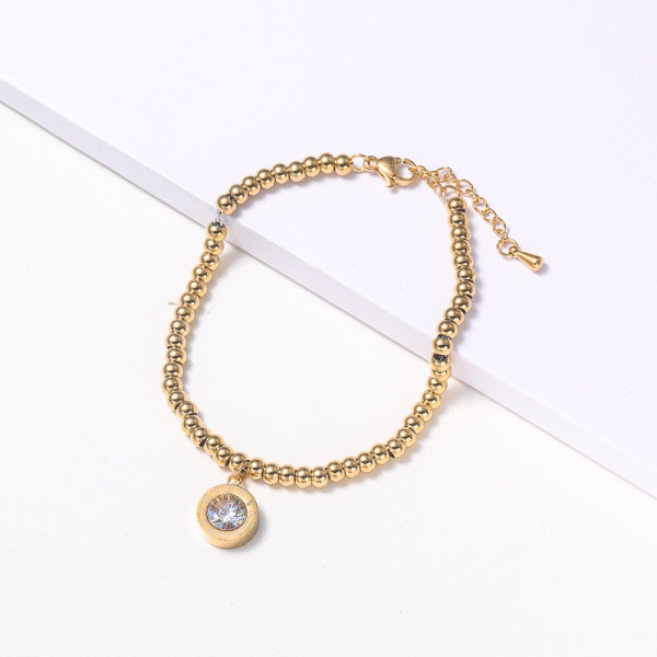 pulsera de acero color dorado con bolitas dije diseno en moda para mujer