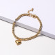 pulsera de moda dorada de bolita con dije de corazon al por mayor