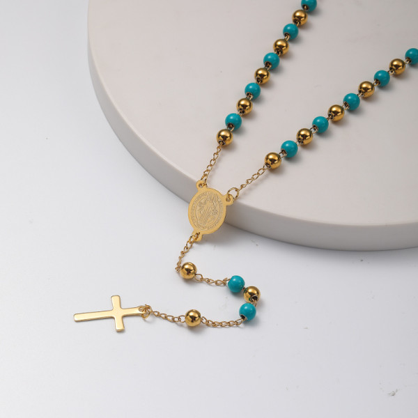 collar de moda de rosario con dijes y colgante cruz y bolita azul