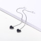aretes de corazoncito negro acero color plateado estilo en moda para mujer