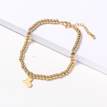 pulsera de acero color dorado con dije corazon estilo en moda para mujer